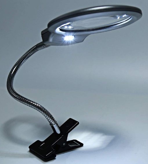 lighted magnifying glass on stand